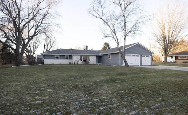 ranch-style house with a front yard and a garage