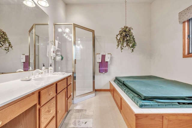 bathroom with vanity and an enclosed shower