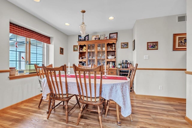 dining space featuring light wood-type flooring