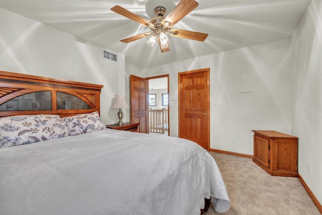 bedroom with ceiling fan and light carpet