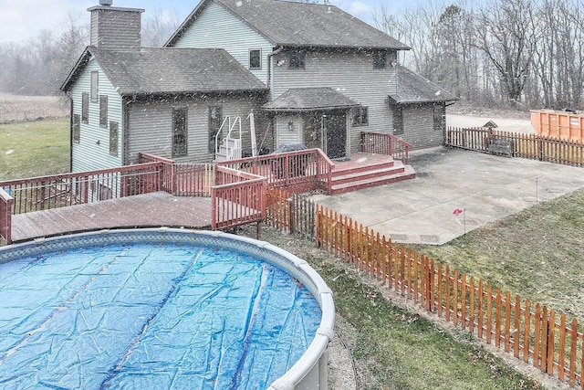 view of pool featuring a wooden deck