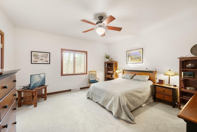 bedroom featuring ceiling fan and light carpet