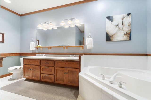 bathroom with tile patterned floors, vanity, crown molding, tiled bath, and toilet