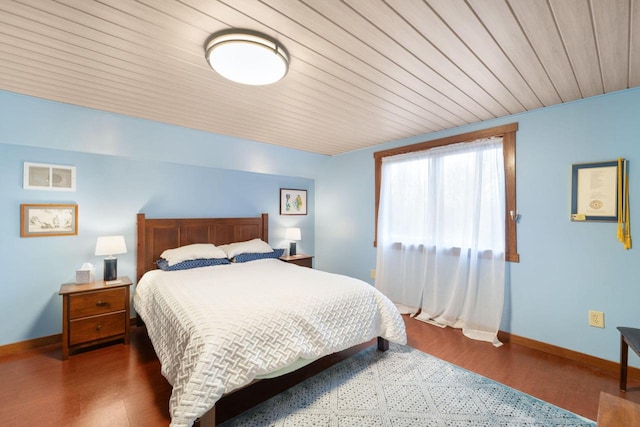 bedroom featuring wood ceiling and dark wood-type flooring