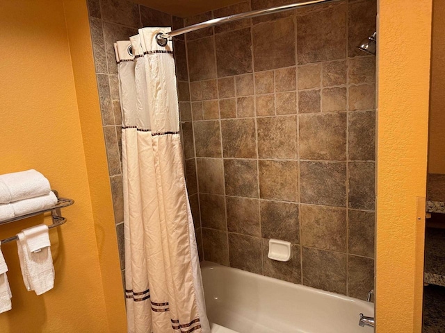 bathroom with shower / tub combo