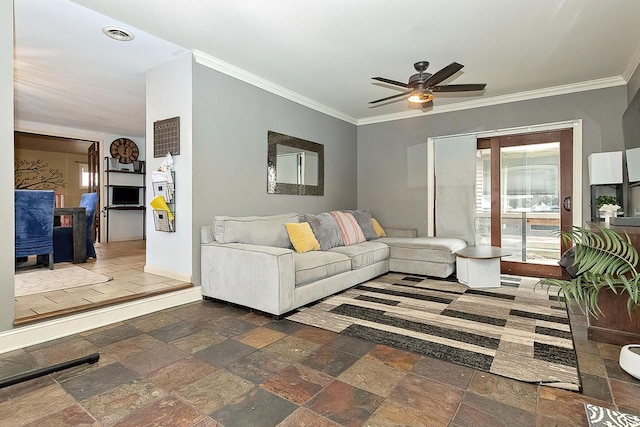 living room with ceiling fan and crown molding