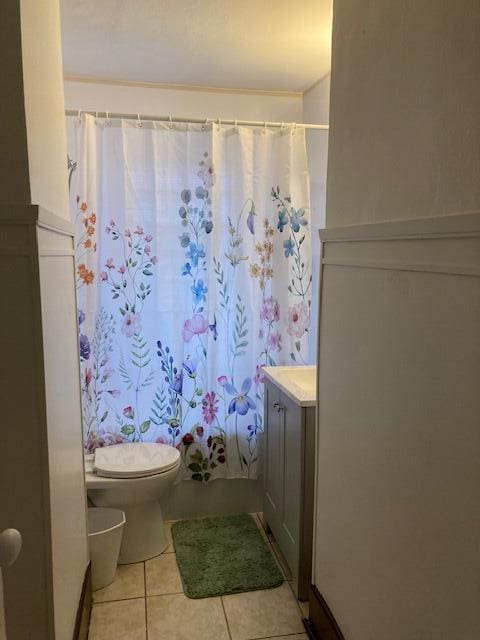 bathroom with tile patterned floors, vanity, and toilet