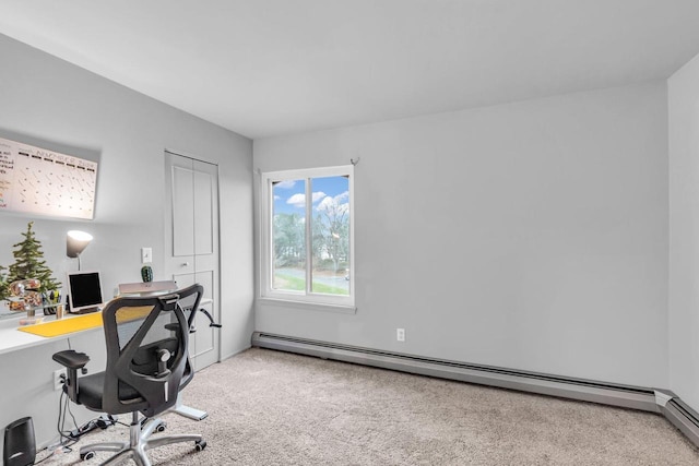 carpeted home office featuring a baseboard heating unit