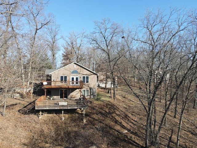 rear view of property with a deck