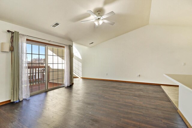 spare room with ceiling fan, dark hardwood / wood-style flooring, and vaulted ceiling