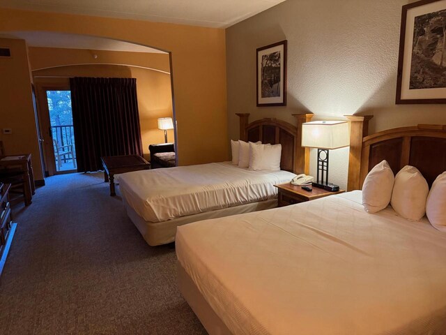 bedroom featuring access to outside and carpet floors