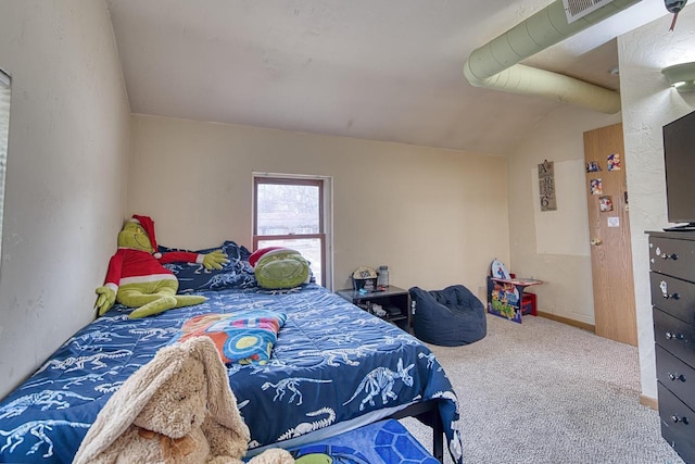 bedroom with carpet flooring and vaulted ceiling