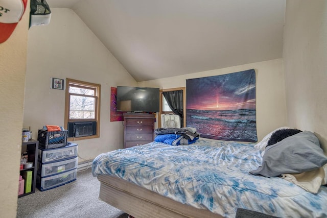 carpeted bedroom with lofted ceiling and a baseboard heating unit