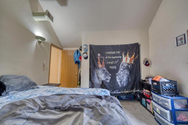 bedroom featuring carpet and vaulted ceiling