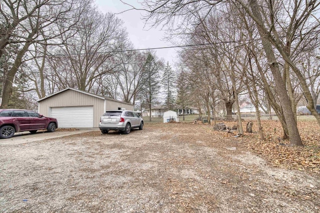 view of yard with an outbuilding and a garage