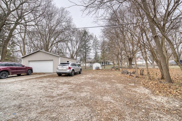 view of yard with a garage and an outdoor structure