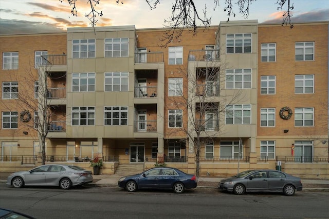 view of outdoor building at dusk