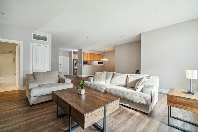 1925 N Water St Unit 100, Milwaukee, WI 53202 - living area with dark wood-type flooring and a chandelier