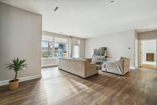 living room featuring dark wood-type flooring