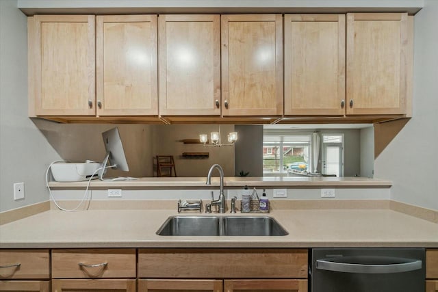 kitchen with dishwasher, light brown cabinets, sink, and an inviting chandelier