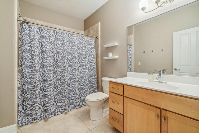 bathroom featuring tile patterned flooring, vanity, and toilet