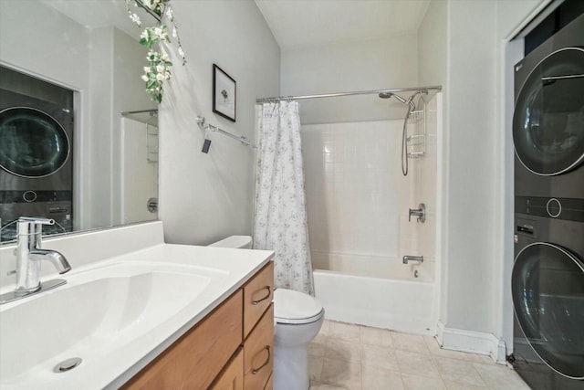 full bathroom with vanity, toilet, shower / bathtub combination with curtain, and stacked washer and clothes dryer