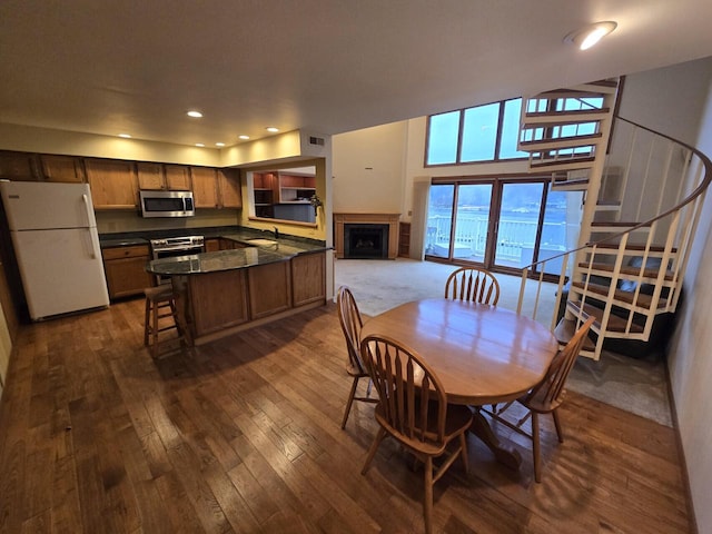 dining area featuring dark hardwood / wood-style flooring and sink