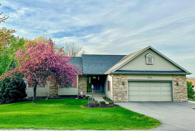 view of front facade with a front lawn and a garage