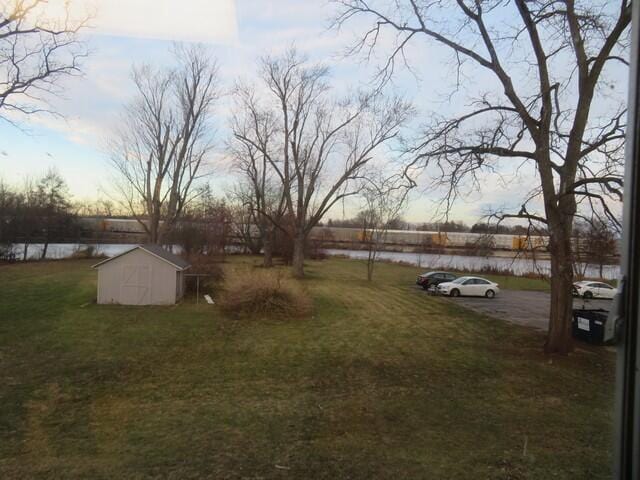 yard at dusk with a storage unit