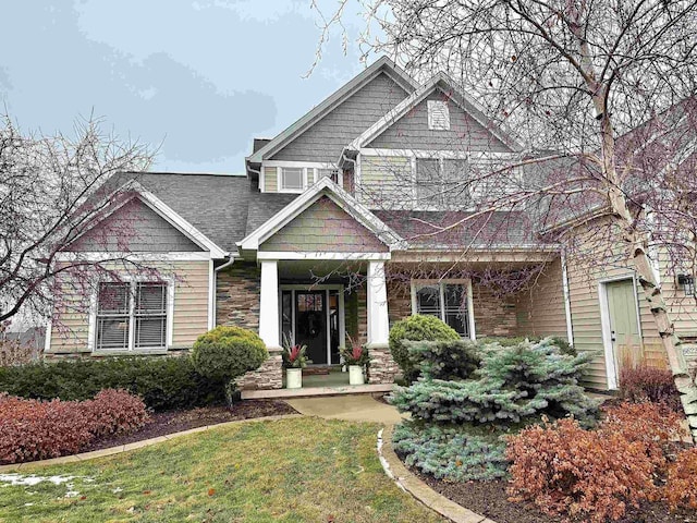 craftsman house with a front lawn