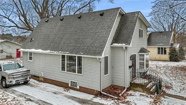 view of snow covered house