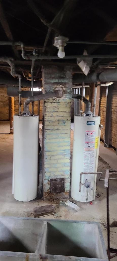 utility room featuring water heater