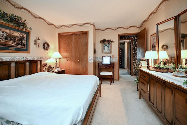 carpeted bedroom featuring a closet