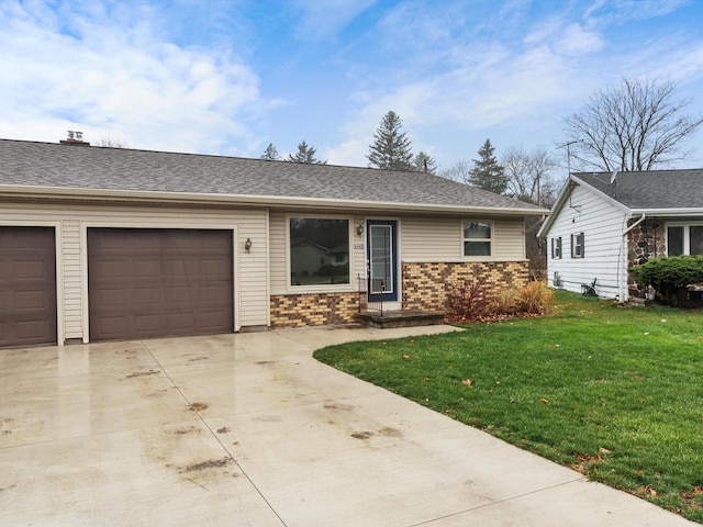 single story home featuring a front yard and a garage