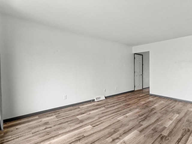 empty room with light wood-type flooring