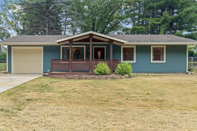 ranch-style house with a garage and a front lawn