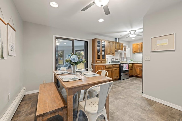 dining area featuring a baseboard heating unit