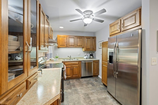 kitchen featuring ceiling fan, sink, and appliances with stainless steel finishes