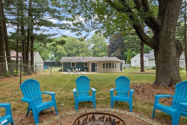 exterior space with a patio and an outdoor fire pit