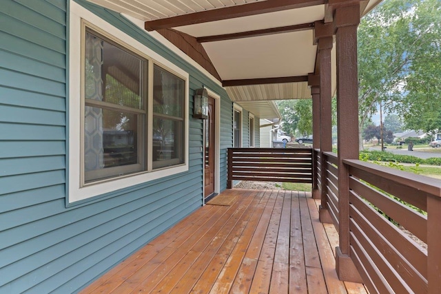 wooden terrace with a porch