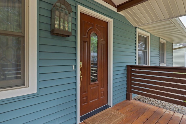 entrance to property featuring a porch