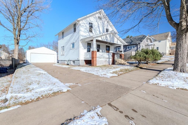 view of front of house with a garage and an outdoor structure