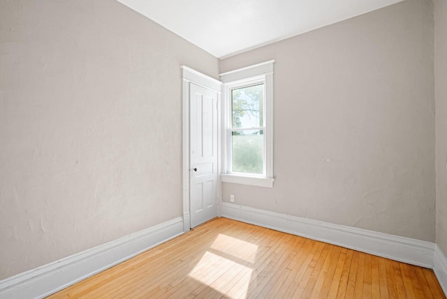 empty room featuring hardwood / wood-style flooring