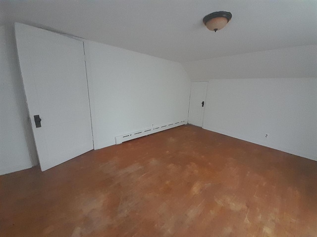 bonus room with baseboard heating and lofted ceiling