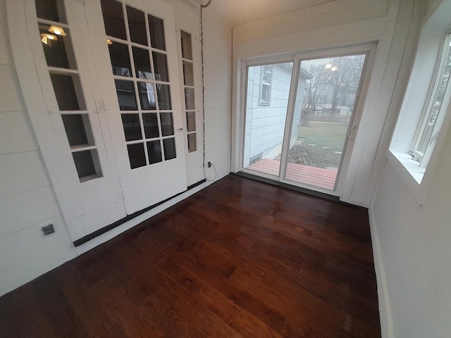 doorway to outside featuring dark hardwood / wood-style flooring and plenty of natural light