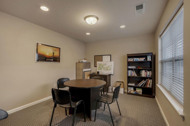 view of carpeted dining area