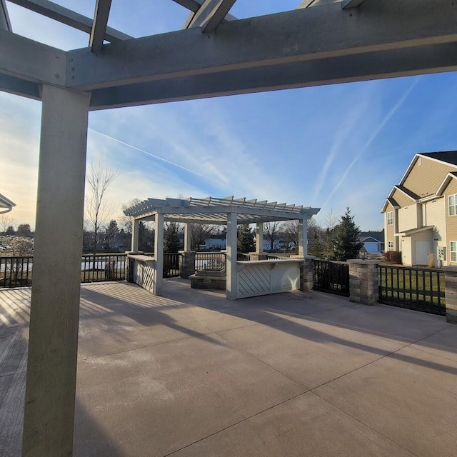 patio terrace at dusk with a pergola