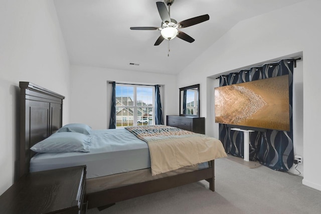 carpeted bedroom featuring vaulted ceiling and ceiling fan