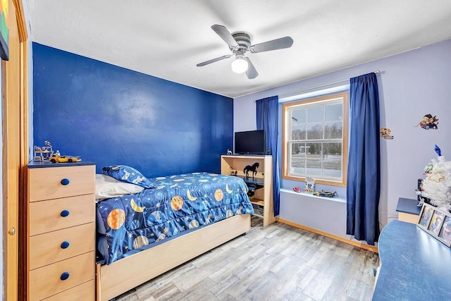 bedroom with ceiling fan and wood-type flooring