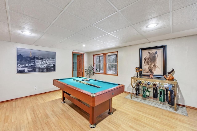 playroom featuring hardwood / wood-style floors, a paneled ceiling, and billiards